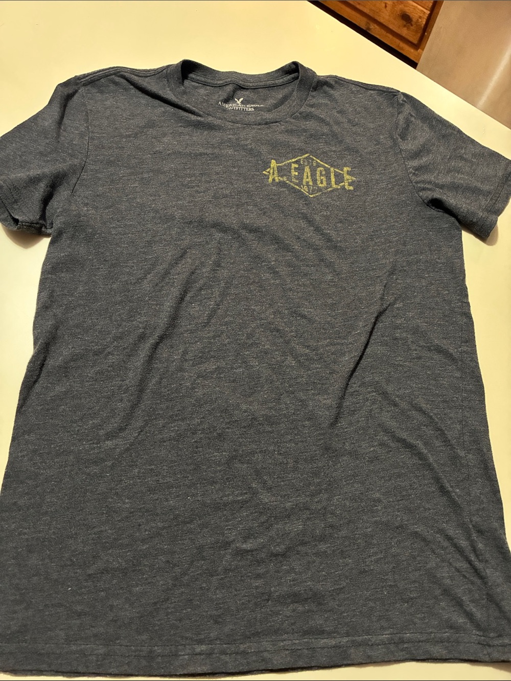 American Eagle Outfitters Heathered Navy Short Sleeve Tee with Yellow Logo